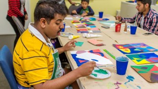 young adult with autism finds more colour for his painting